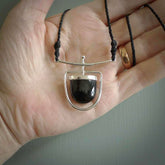 Hand crafted contemporary black jade and sterling silver drop necklace. This necklace is provided with a fern green cord and silver clasp. Contemporary black jade drop necklace with sterling silver.